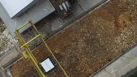 Dried Natural Raw Rubber Piled on Cement Ground with Mechanical Grabber Video stock 296523108