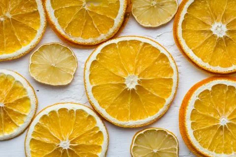 Dried orange and lemon on old white painted wood. Stock Photos