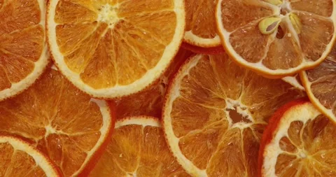 Dried orange slice. Slice oranges rotate.Background Food. Super slow motion Stock Footage 167968884