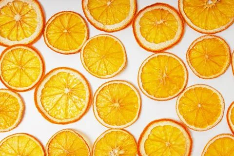 Dried orange slices close-up on the white background Stock Photos