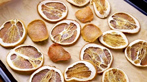 Dried oranges on a baking sheet Stock Footage 145986838