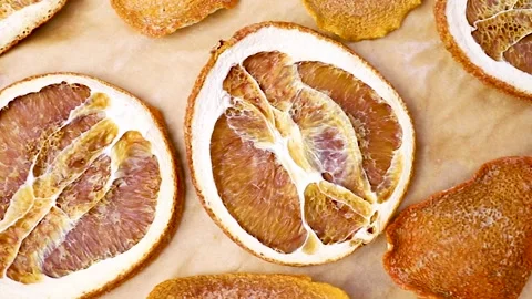 Dried oranges on a baking sheet Stock Footage 145986850