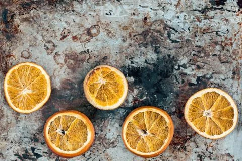 Dried oranges on an old baking sheet Stock Photos