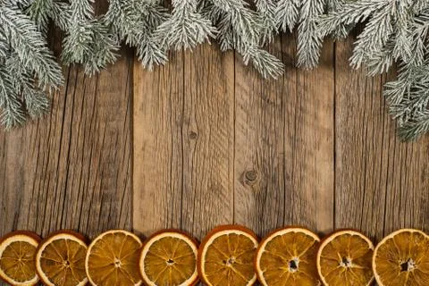 Dried oranges from the tree branches on an old wooden table. Stock Photos