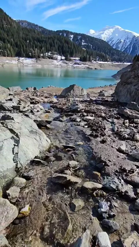 Dried out lake in the mountains Stockbeeldmateriaal 319348405
