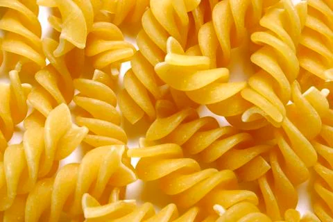 Dried pasta fusilli background Stock Photos