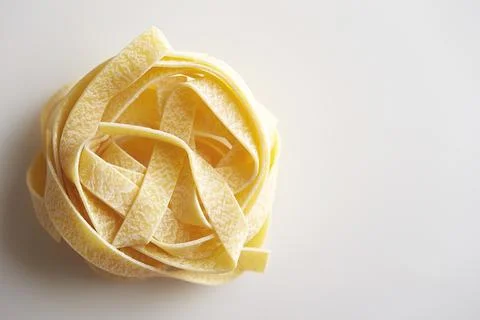 Dried pasta on a white background Stock Photos