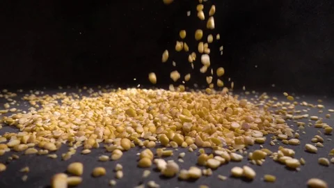 Dried peas are poured on a table, black background. Stock Footage 101981734