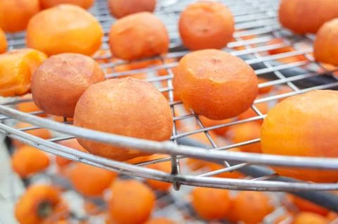 Dried up persimmon under the sun Stock Photos