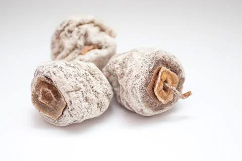 Dried persimmons on white background Stock Photos