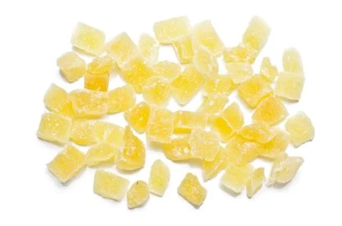 Dried pineapples cubes on the white Stock Photos