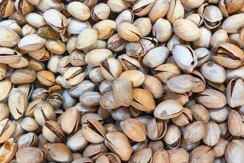Dried pistachio nuts as a background Stock Photos