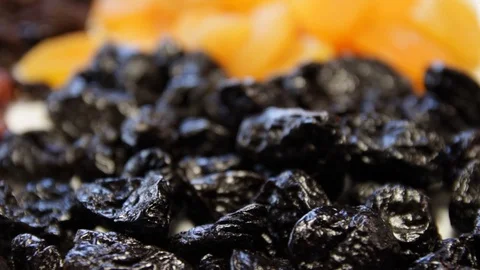 Dried prunes.close-up.macro.the camera moves around this to the right Stock Footage 122410889
