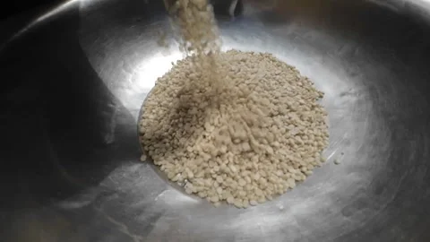 Dried Raw Split White Lentils-Urad Lentils Pouring In Steel Bowl in Slow Motion Stock Footage 251952456