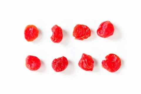 Dried red cherry tomatoes on plain background Stock Photos