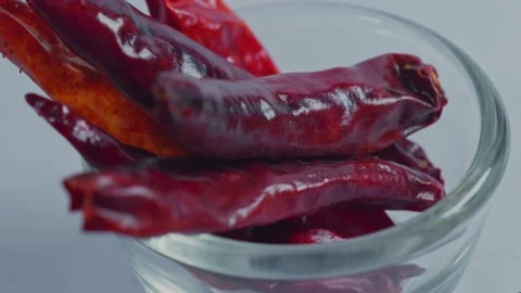 Dried red chilli or Sukhi lal mirch in small glass bowl, 4k, parallax shot. Stock-Footage 297857081