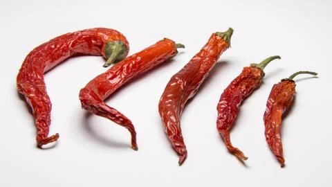 Dried red chilli peppers Stock Photos