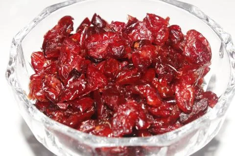 Dried red cranberry heaped up in glass bowl Stock Photos