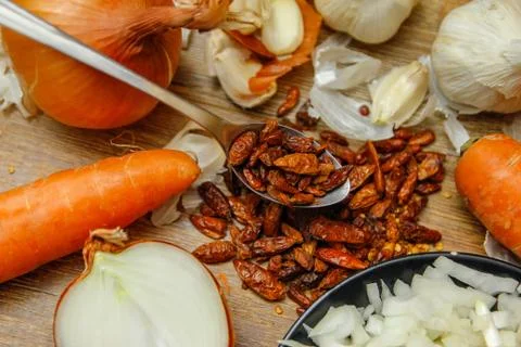 Dried red hot small chilli peppers in spoon Stock Photos