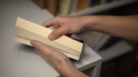 Dried Red Rose Pressed between book pages Stock Footage 129830525