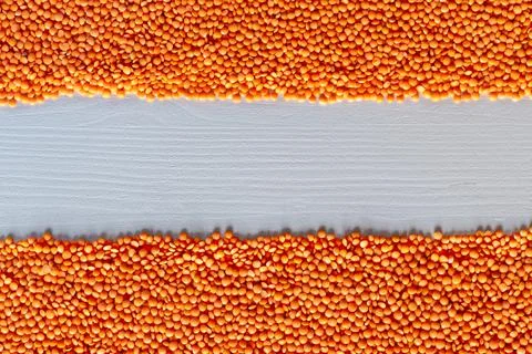 Dried red Split Lentils background. Stock Photos