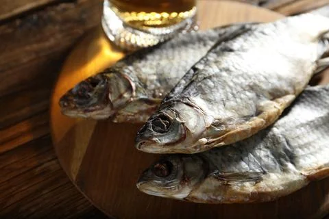 Dried roach fish on wooden table, closeup Stock Photos