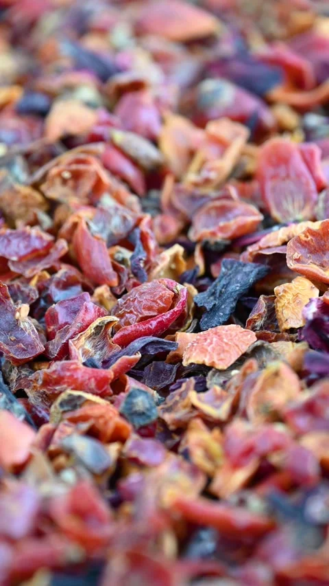 Dried rose hip shells scattering across market table close up Stock Footage 331585475