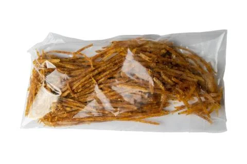 Dried salmon cobweb with pepper in a transparent package appetizer to beer is Stock Photos