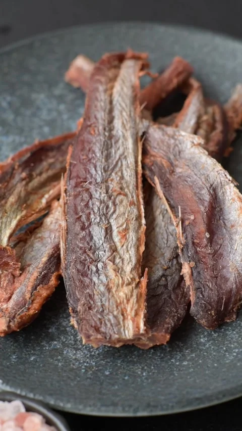 Dried salted fish as snacks or jerky, seafood as slices. Dried seafood snacks Stock Footage 315245669