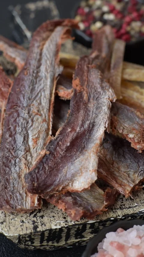 Dried salted fish as snacks or jerky, seafood as slices. Dried seafood snacks Stock Footage 315245679