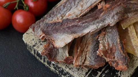 Dried salted fish as snacks or jerky, seafood as slices. Dried seafood snacks Stock Footage 315245692