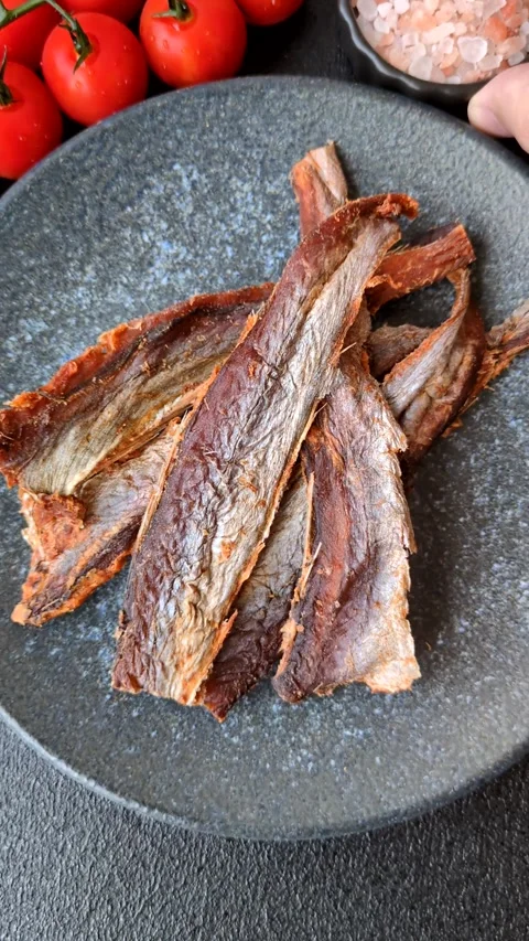 Dried salted fish as snacks or jerky, seafood as slices. Dried seafood snacks Stock Footage 315245702