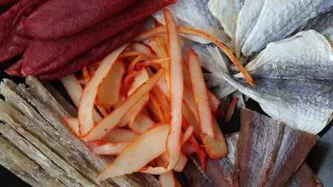 Dried salted mackerel fish, cod fillets, calamari and peppers, tuna and caviar Stock Footage 229955932
