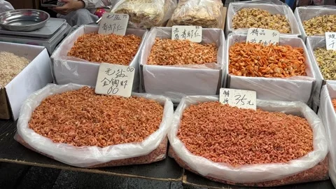 Dried Seafood Displayed in Bulk at a Dandong Market Stall Stock Footage 340175990