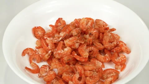 Dried Shrimp Falling Onto White Plate Close Up Stock Footage 337779373