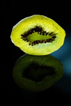 Dried slice of kiwi on a dark background Stock Photos