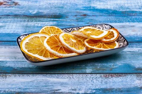 Dried slices of oranges on a rectangular plate Stock Photos