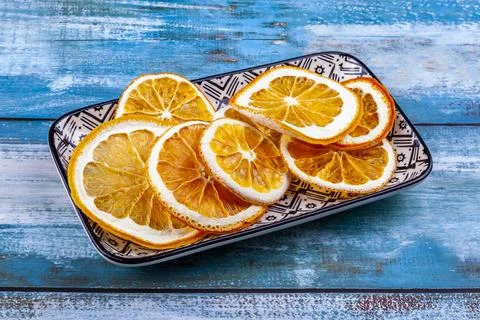 Dried slices of oranges on a rectangular plate Stock Photos