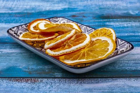 Dried slices of oranges on a rectangular plate Stock Photos