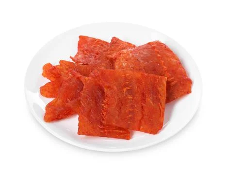 Dried spicy cod fillets isolated on white Stock Photos