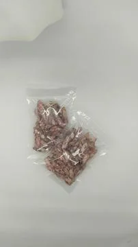 Dried squid in plastic packaging ready to be sold Stock Photos