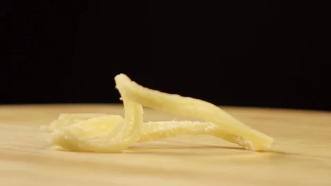 Dried squid rotates 360 degrees on a wooden platform Stock Footage 119284385