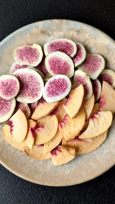 Dried sublimated fig and peach slices as an ingredient for desserts. Dried figs  Stock Footage 318614039