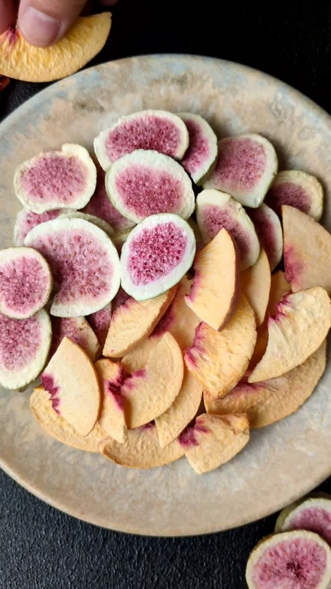 Dried sublimated fig and peach slices as an ingredient for desserts. Dried figs  Stock Footage 318614043