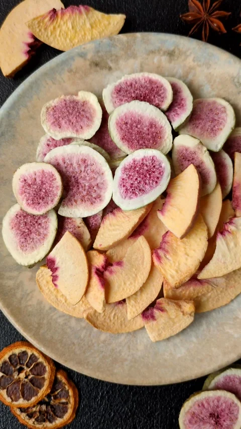 Dried sublimated fig and peach slices as an ingredient for desserts. Dried figs  Stock Footage 318614045