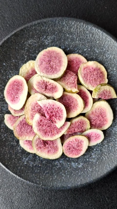 Dried sublimated fig slices as an ingredient for sweet desserts. Dried figs Stock Footage 318614000