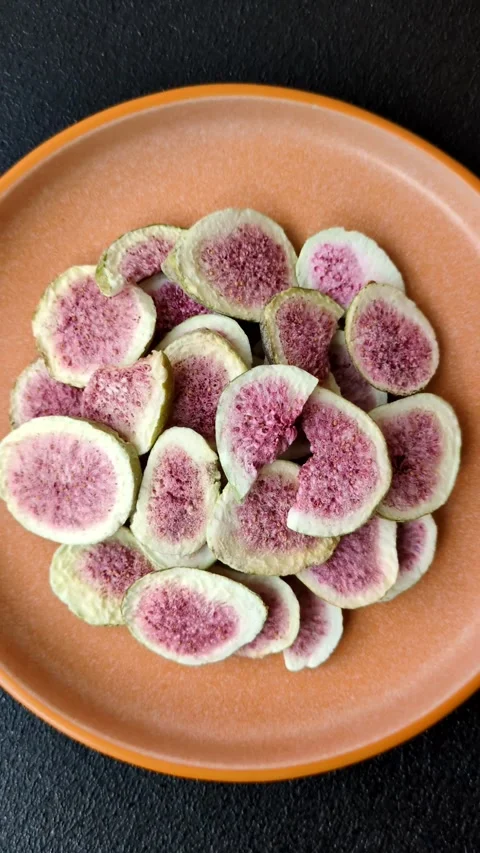 Dried sublimated fig slices as an ingredient for sweet desserts. Dried figs Stock Footage 318614014