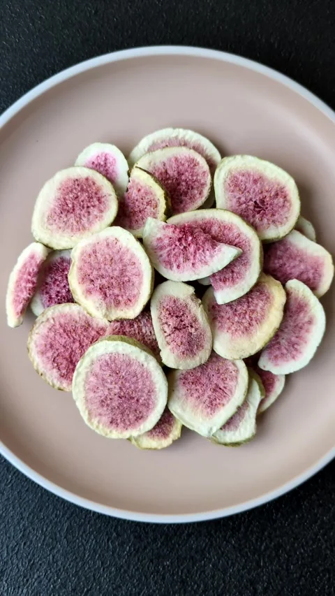Dried sublimated fig slices as an ingredient for sweet desserts. Dried figs Stock Footage 318614027