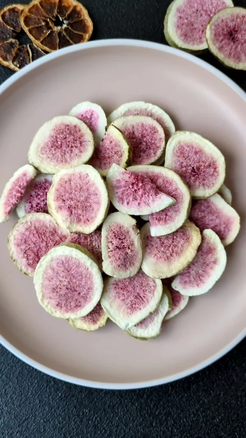 Dried sublimated fig slices as an ingredient for sweet desserts. Dried figs Stock Footage 318614032