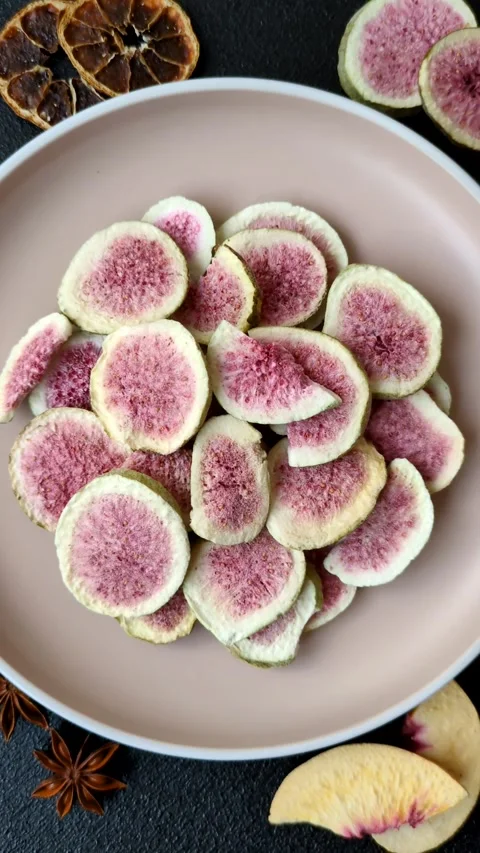 Dried sublimated fig slices as an ingredient for sweet desserts. Dried figs Stock Footage 318614035